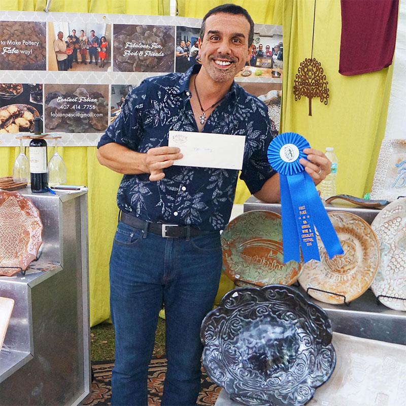 Fubu Pottery craft booth showing off their first place award